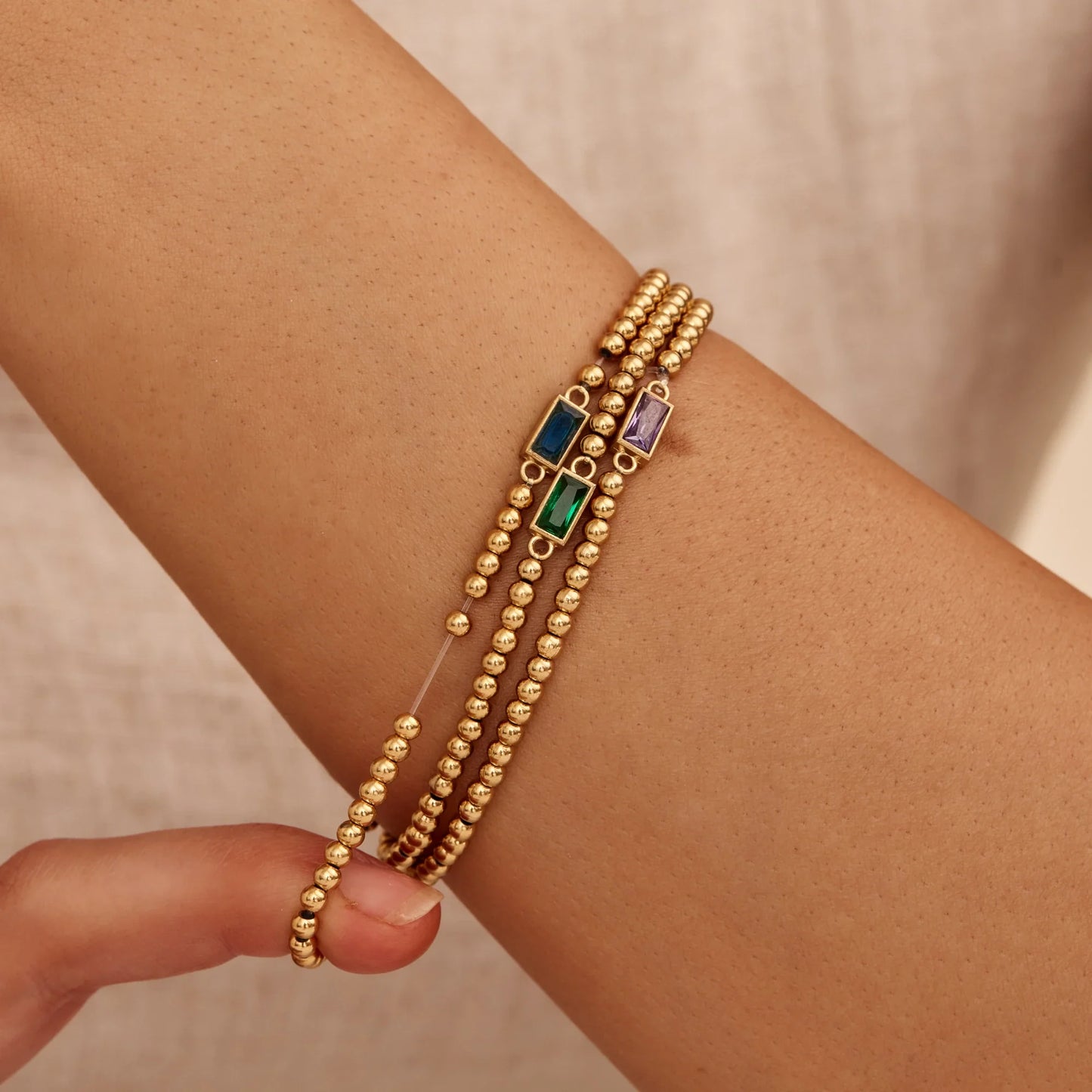 Elegante gouden kralenarmband met geboortesteen