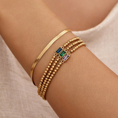 Elegante gouden kralenarmband met geboortesteen