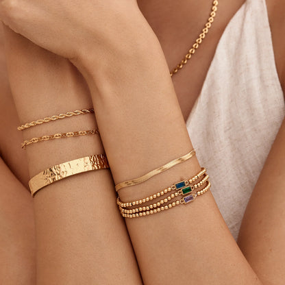Elegante gouden kralenarmband met geboortesteen